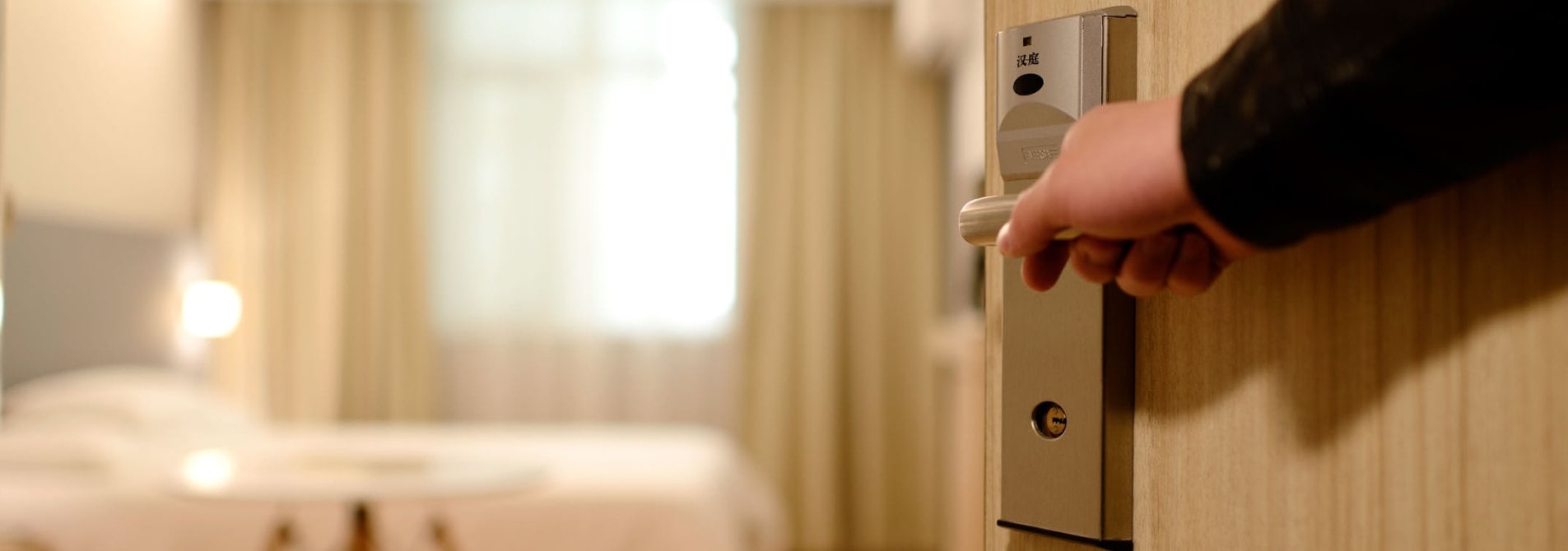 Hotel room door opens